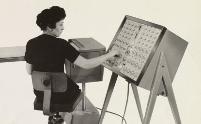 woman using a computer from 1964
