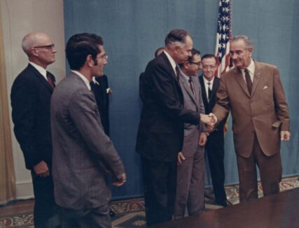 Glenn Seaborg shaking hands with Lyndon B. Johnson