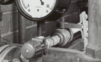 black and white photo of pipes and fittings